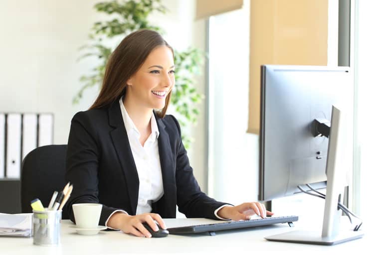 Woman-Smiling-with-Computer-IMG Woman-Smiling-with-Computer-IMG